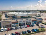 Exterior aerial view of parking lot and multiple buildings apart of Floor & Decor Mesquite