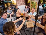 Multiple people on patio enjoying Tap N Fill Beer Idaho Falls Brewing 