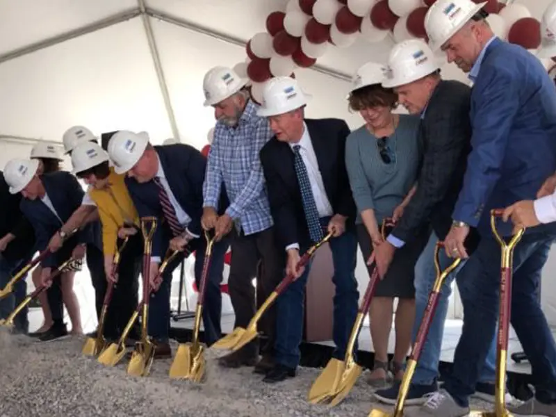 Ball Ventures leadership team in hardhats shoveling first groundbreaking