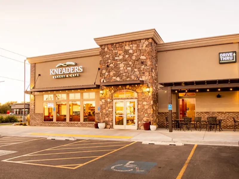 Exterior of front of multiple building and parking area at Sandcreek Commons