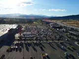 Exterior drone shot of parking lot and buildings within Center Pointe shopping center