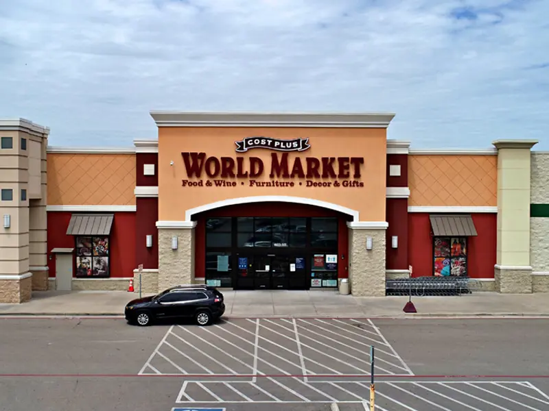 Exterior aerial view of World Market building and parking area apart of Central Texas Marketplace