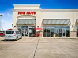 Exterior view of front of Five Guys building at 887 Lufkin shopping center location