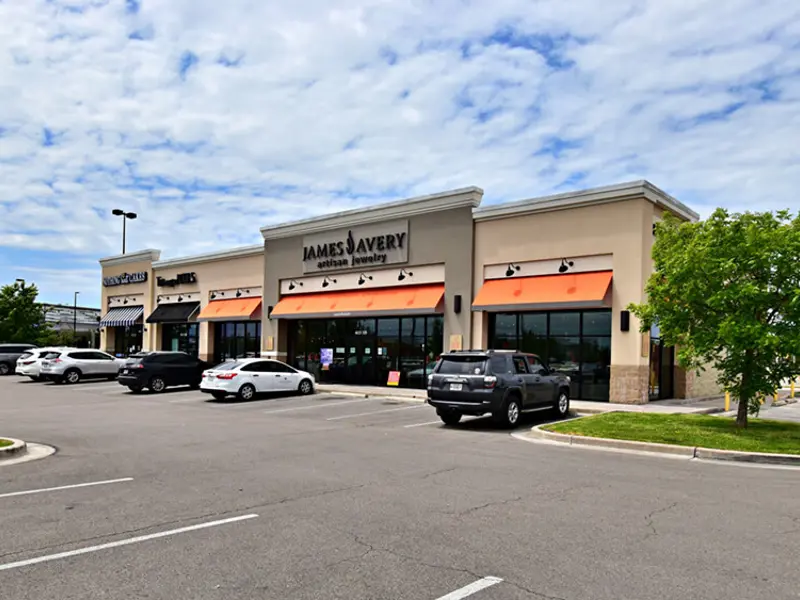 Exterior view of multiple buildings and parking areas apart of Central Texas Marketplace