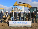 9 Ball Ventures leaders posing for groundbreaking ceremony for Current Apartment Complex