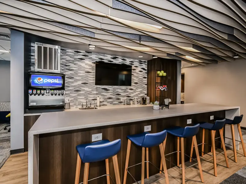 Interior of kitchen area and lounge within The Knolls Suite 300 Ball Ventures
