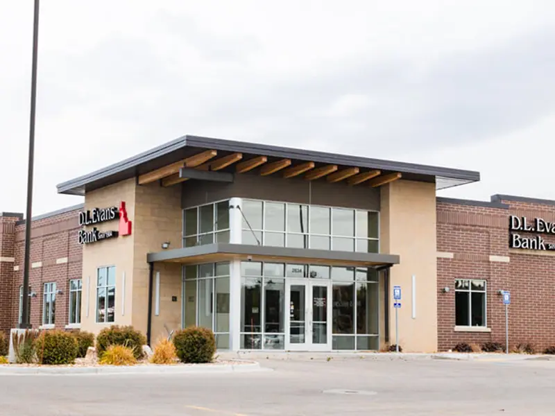 Exterior of building and parking area at Sandcreek Commons