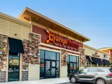 Exterior front of Orange Theory building at Center Pointe shopping center during day