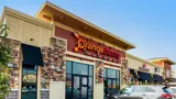 Exterior of Orange Theory entrance to building on sunny day at Center Pointe shopping center