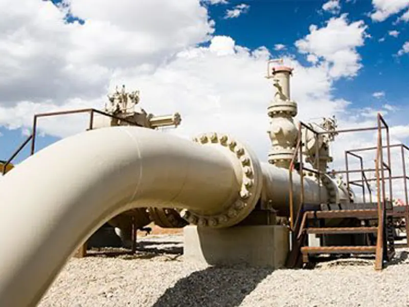 Exterior shot of large steel piping on sunny day