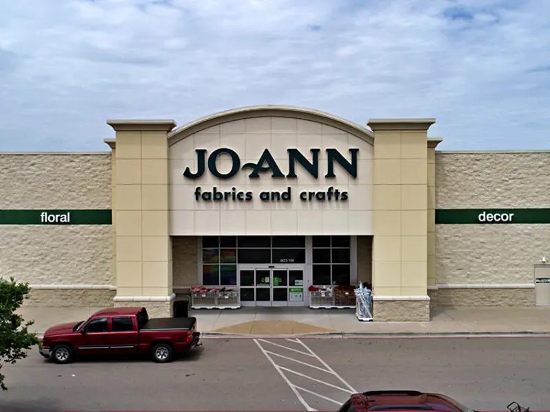 Exterior view of Joann building and parking area apart of Central Texas Marketplace