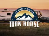 Iron Horse RV and Trailer logo on top of sunset picture of RV and truck