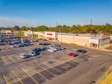 Exterior aerial shot of parking lot and building apart of Massard Crossing
