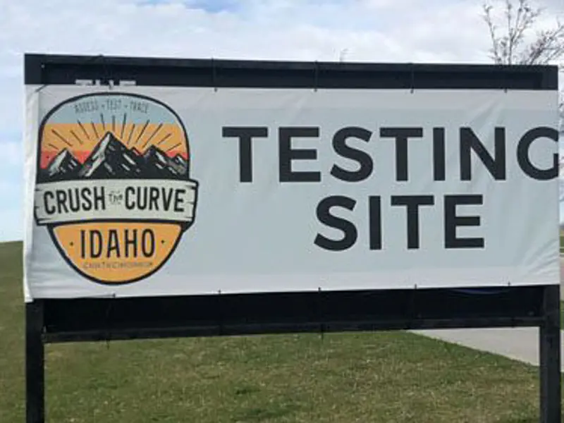 Exterior photo of Crush the Curve COVID-19 sign offering antibody testing in Idaho Falls