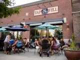 Exterior of patio and front of Tap N' Fill building at Snake River Landing