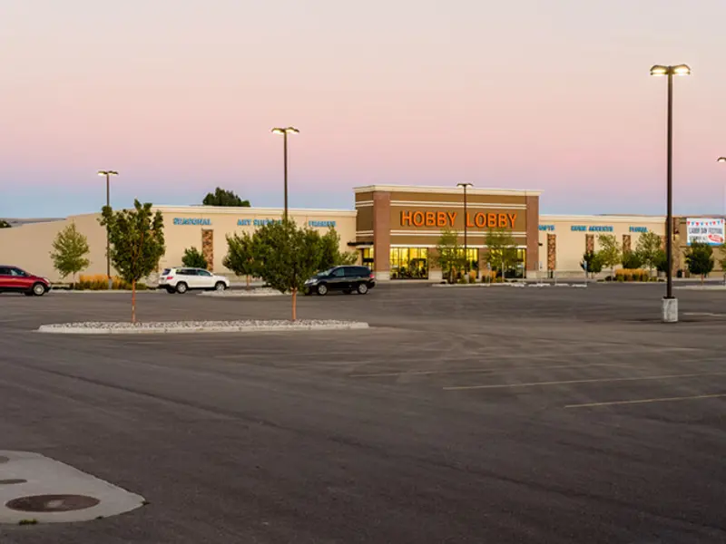 Exterior of front of Hobby Lobby building and parking area at Sandcreek Commons