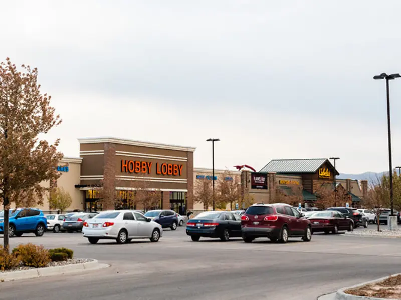 Exterior of front of Hobby Lobby building and parking area at Sandcreek Commons